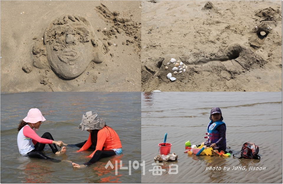 가족과 동반한 어린이들 바닷물속에서 고운 모래로 즐기고 있다.   정 지순 기자