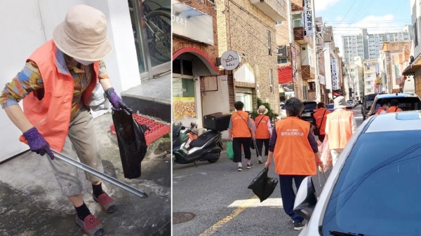 함지노인복지관 노인일자리 참여자들이 먹거리 타운을 다니며, 청소를 하고 있다.